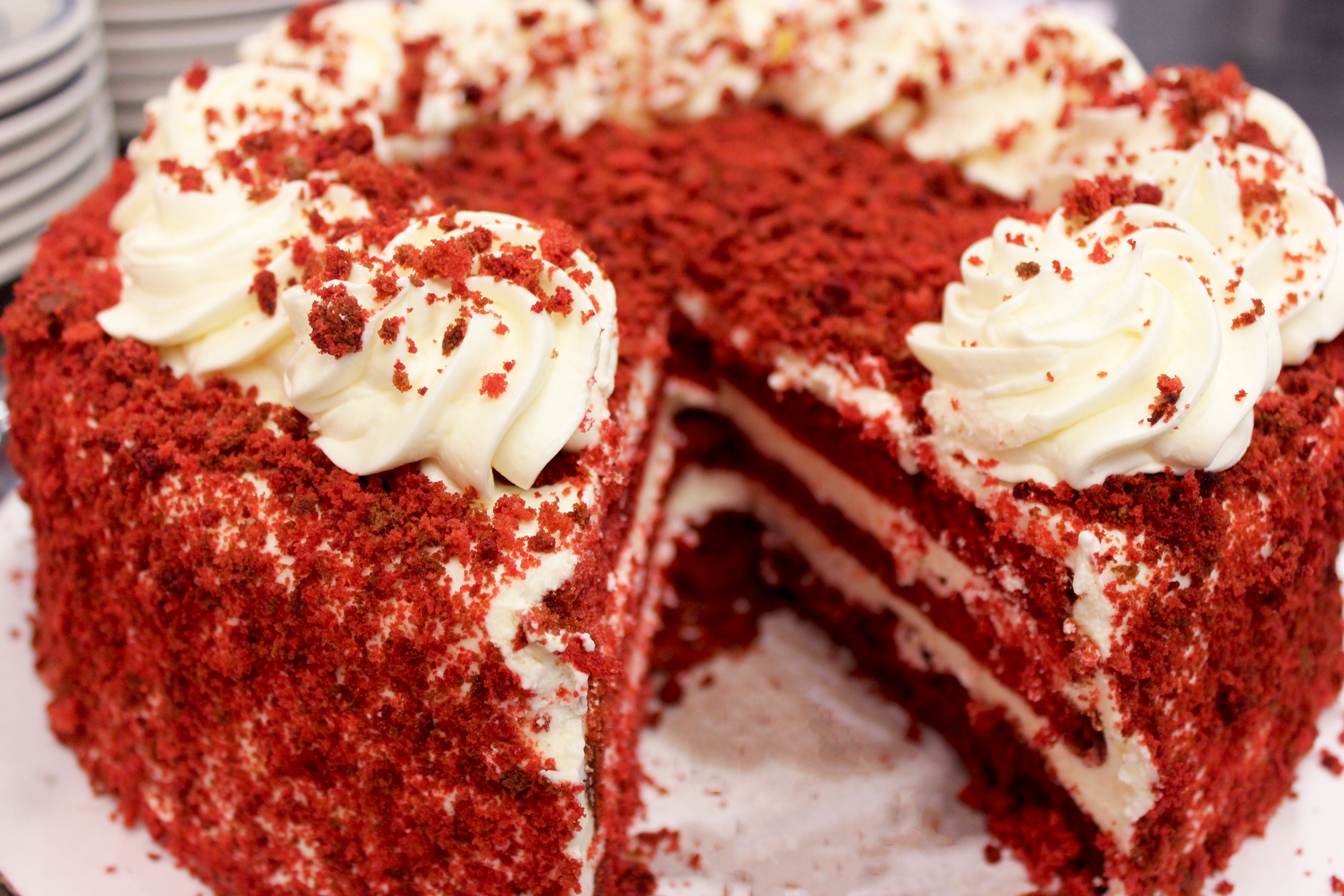 Red velvet cake with cream cheese frosting and red velvet crumb topping